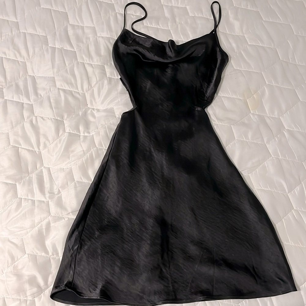 Forever 21 black silky dress with cut out sides and lace up back.  Size M